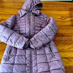 Below the hip length woman’s Kenneth Cole coat